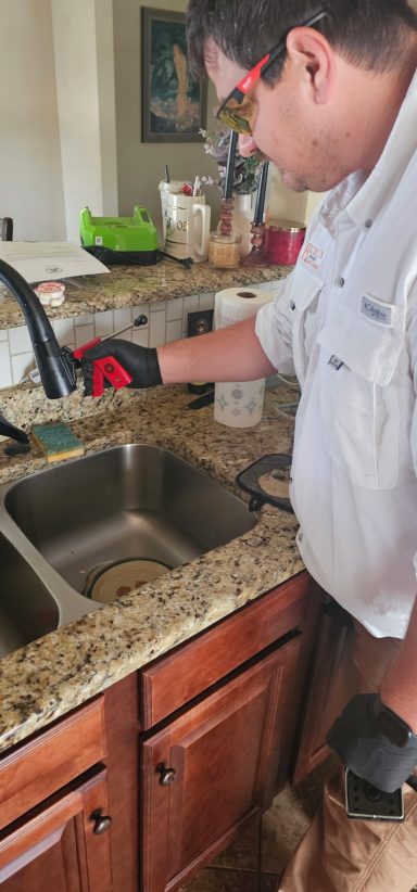 Treating for Ants around a sink Pest Tach treating the ants around a sink with bait